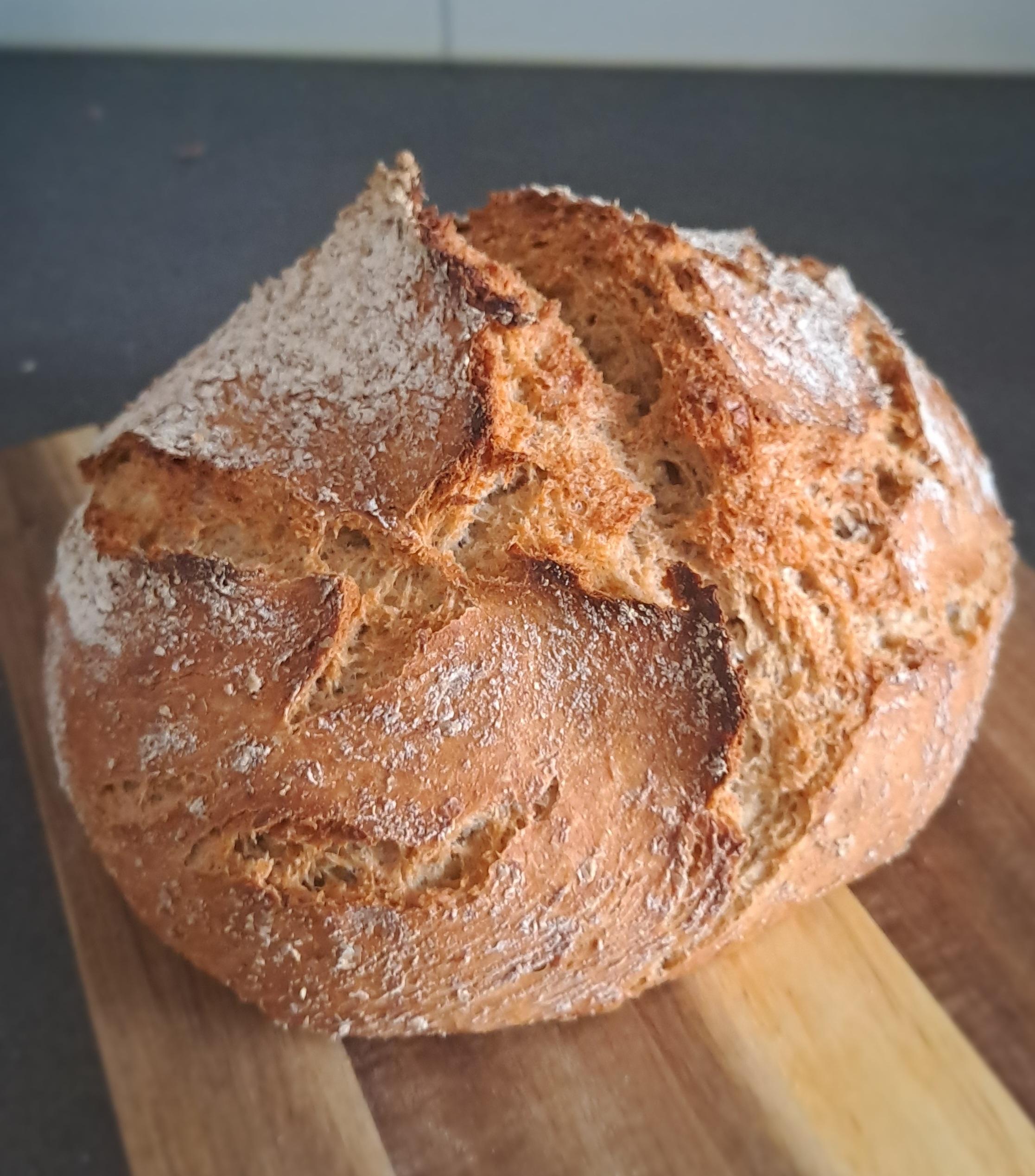 todays bread sitting on a wooden cutting board